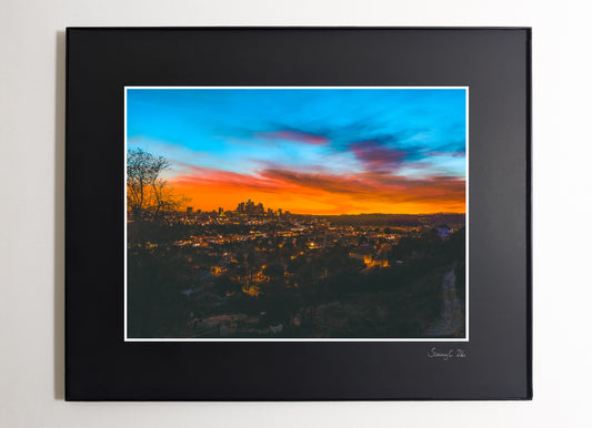 Framed photograph of the skyline of downtown Los Angeles with an orange-blue sunset