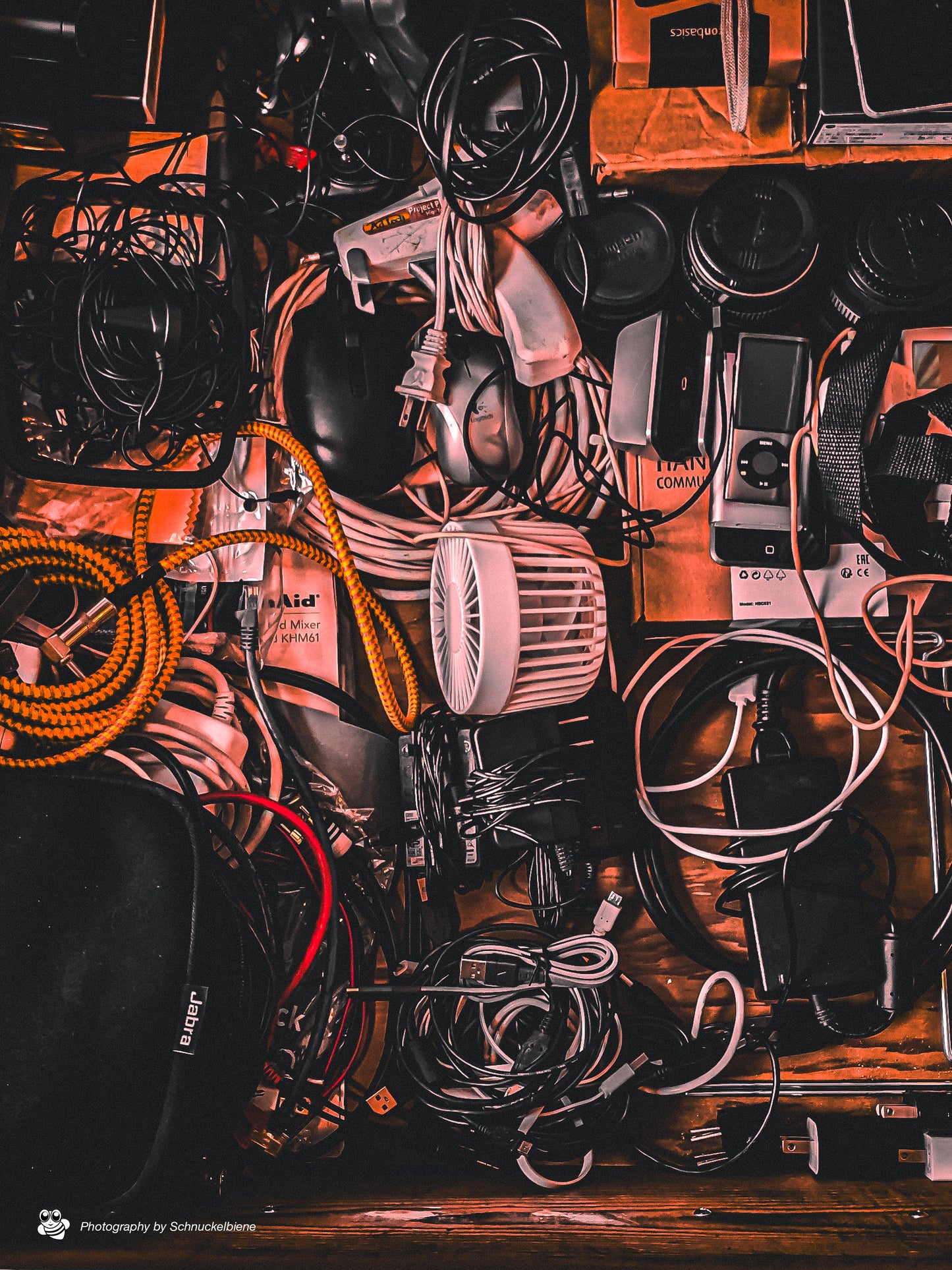 A drawer of electronics. Everybody has such a drawer, it can look beautiful. As background image or as atmospheric wall photo in the music studio.