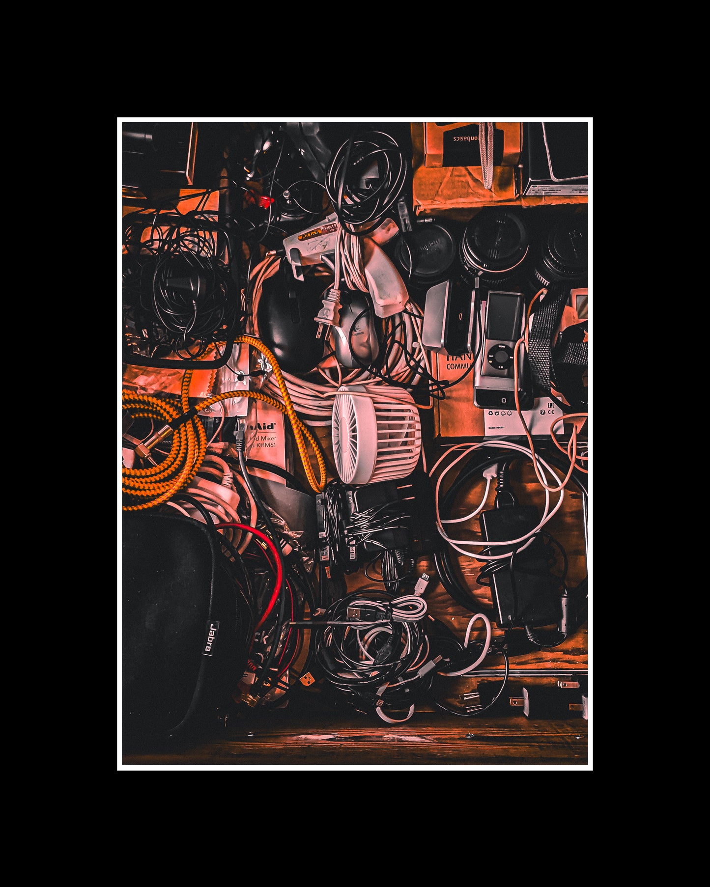 A drawer of electronics. Everybody has such a drawer, it can look beautiful. As background image or as atmospheric wall photo in the music studio.