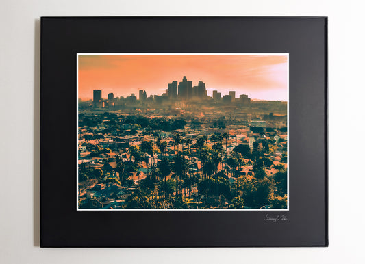 Framed cityscape print with a hazy sunset over the Downtown Los Angeles skyline