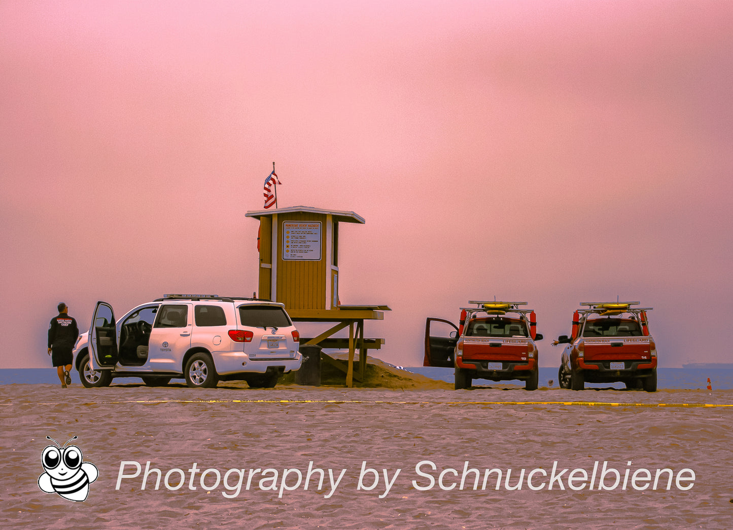 Huntington Beach lifeguard tower reunion under pink cloudy sky