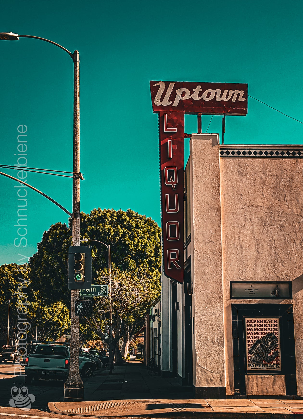 Framed photo print of the Uptown Whittier Liquor Shop with retro typography and bold colors