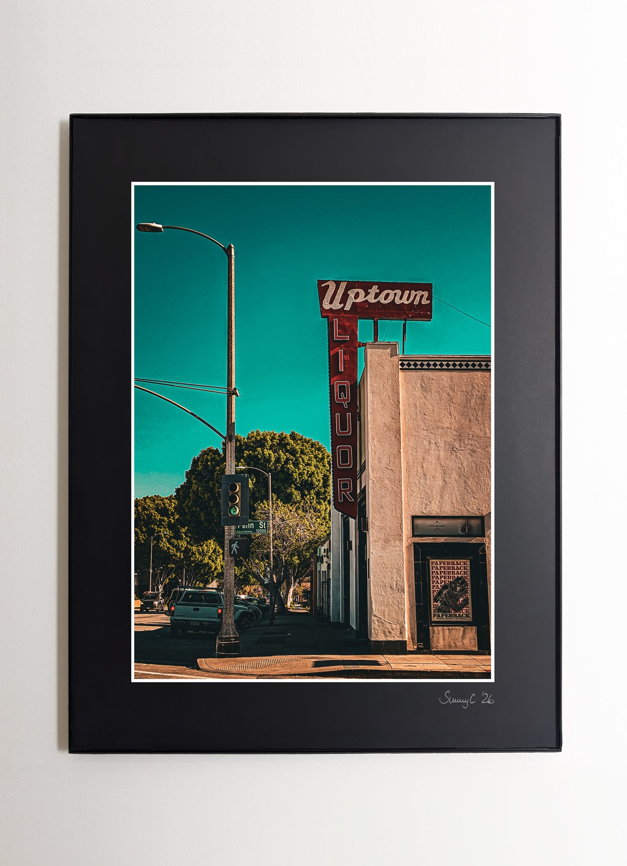 Framed photo print of the Uptown Whittier Liquor Shop with retro typography and bold colors