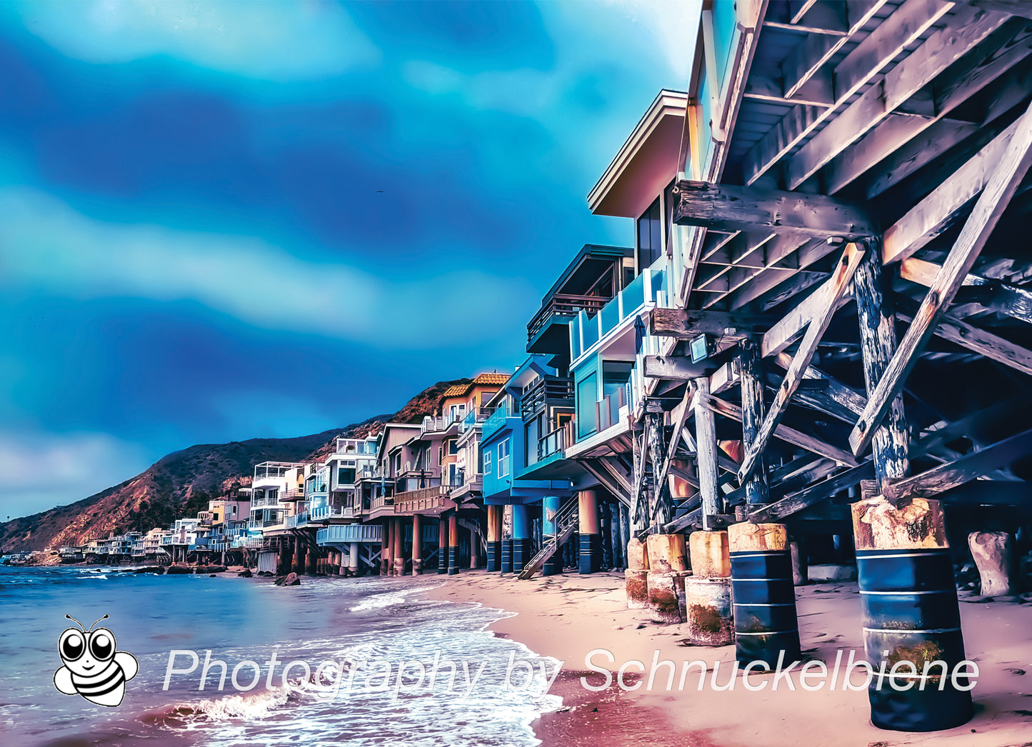 Photo of Malibu beachfront houses lined up along the California coast