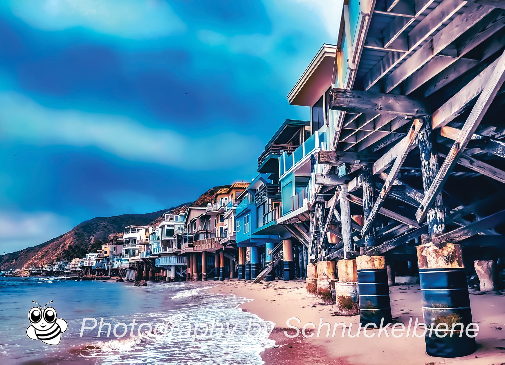 Photo of Malibu beachfront houses lined up along the California coast