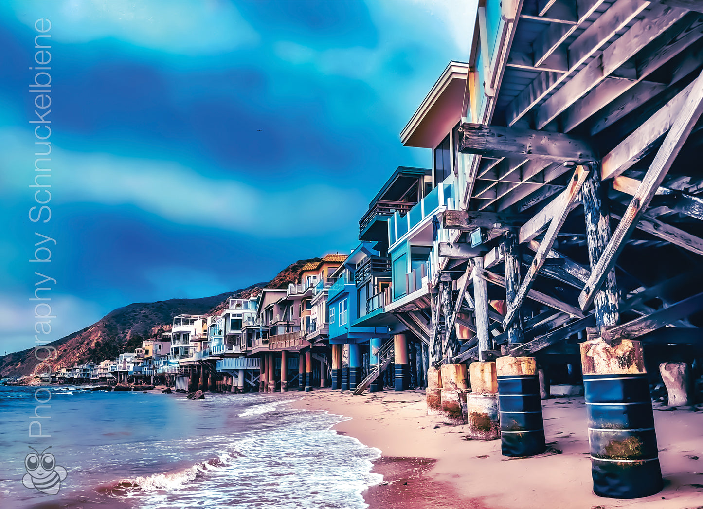 Photo of Malibu beachfront houses lined up along the California coast