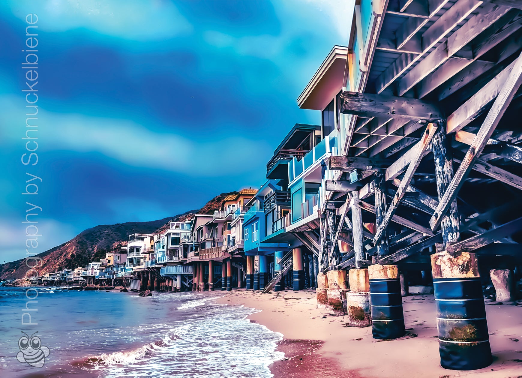 Photo of Malibu beachfront houses lined up along the California coast