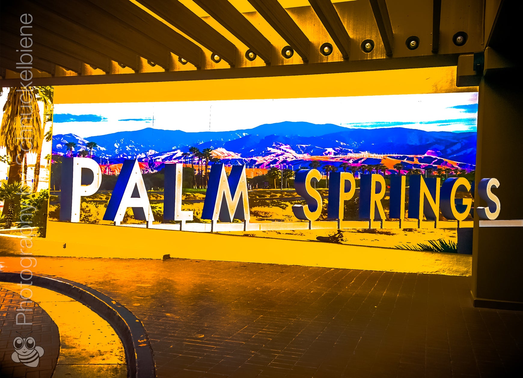 Framed photograph of a the Palm Springs letters sign at Hilton Hotel with a scenic desert background