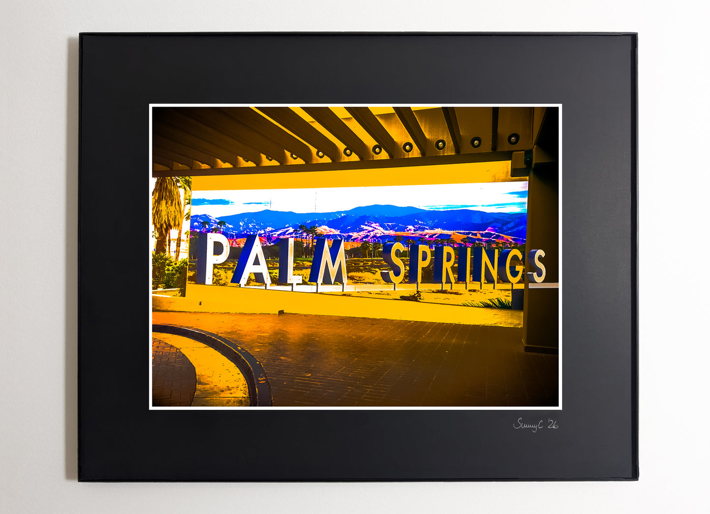Framed photograph of a the Palm Springs letters sign at Hilton Hotel with a scenic desert background