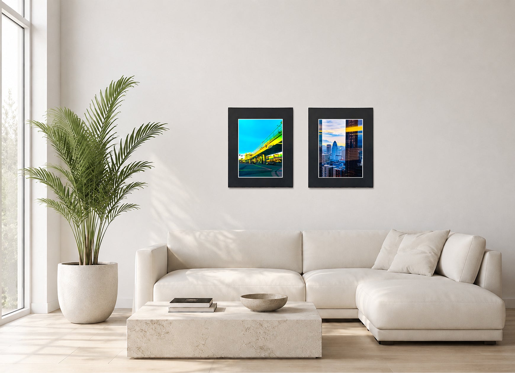 Two framed fine art photography prints displayed as a diptych gallery wall above a sofa with plant.