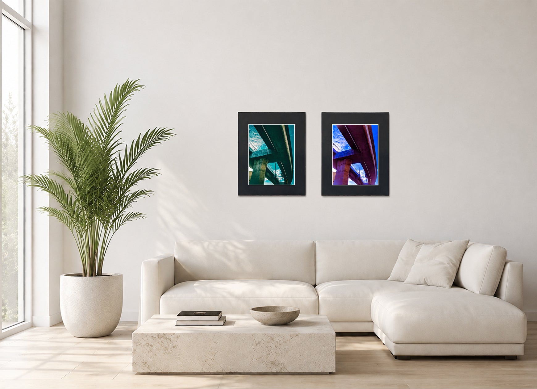 Two framed fine art photography prints displayed as a diptych gallery wall above a sofa with plant.