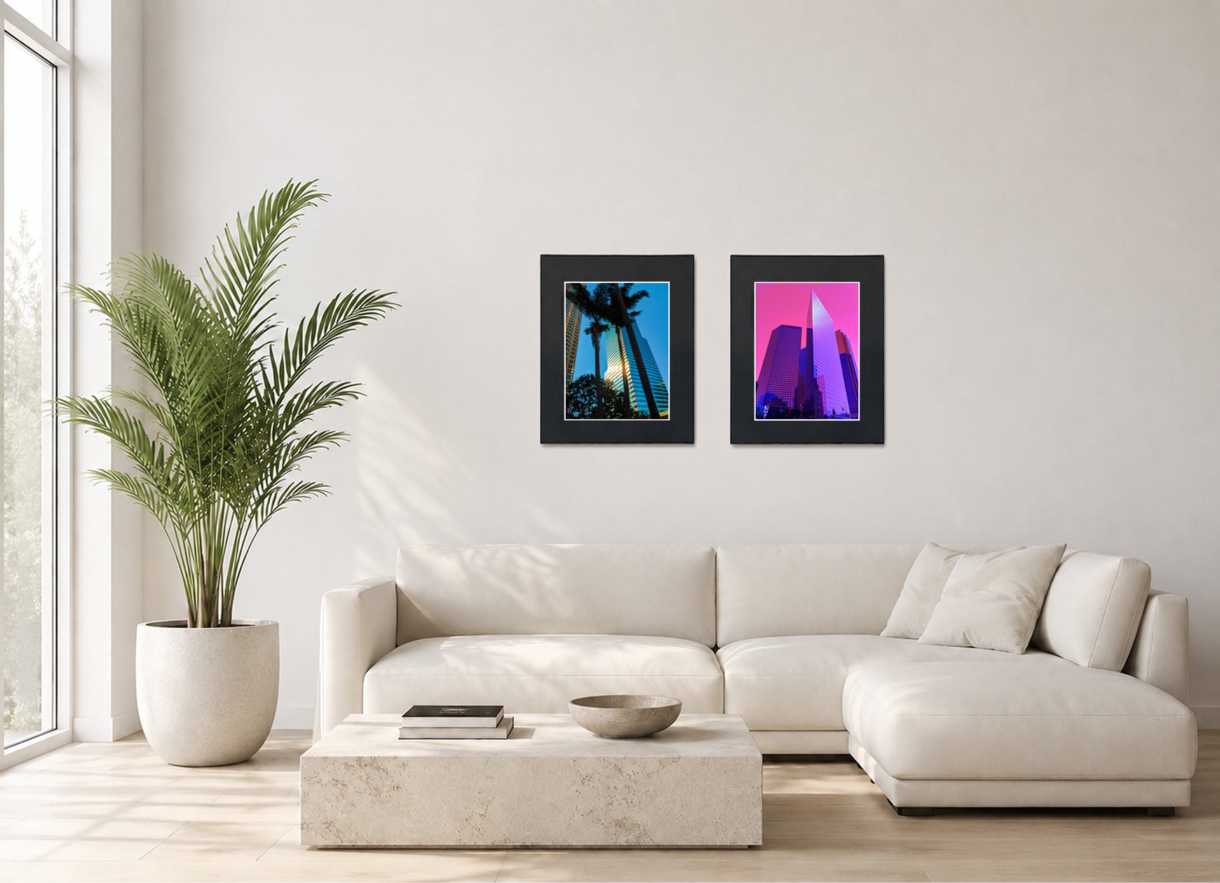 Two framed fine art photography prints displayed as a diptych gallery wall above a sofa with plant.