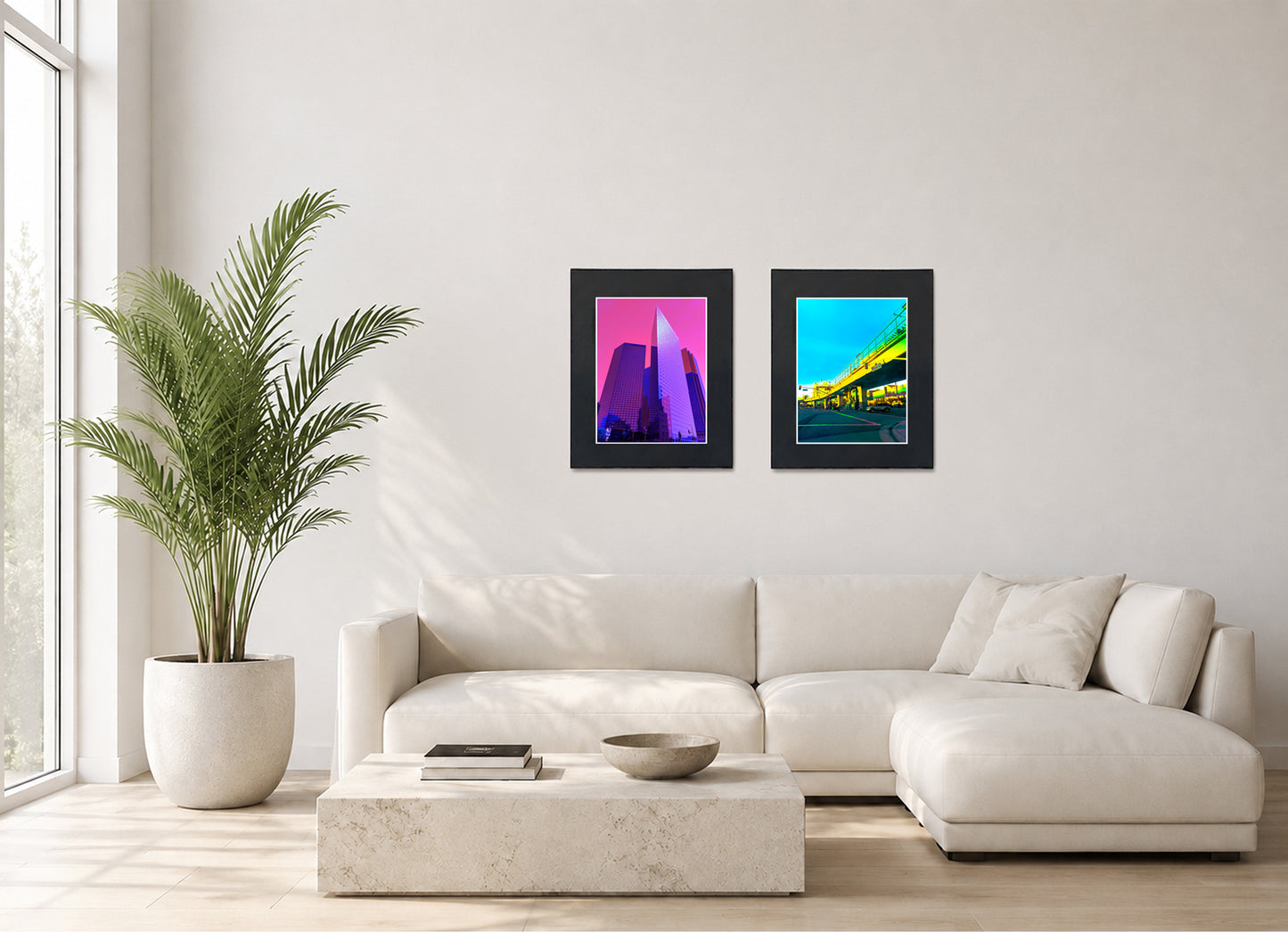 Two framed fine art photography prints displayed as a diptych gallery wall above a sofa with plants.