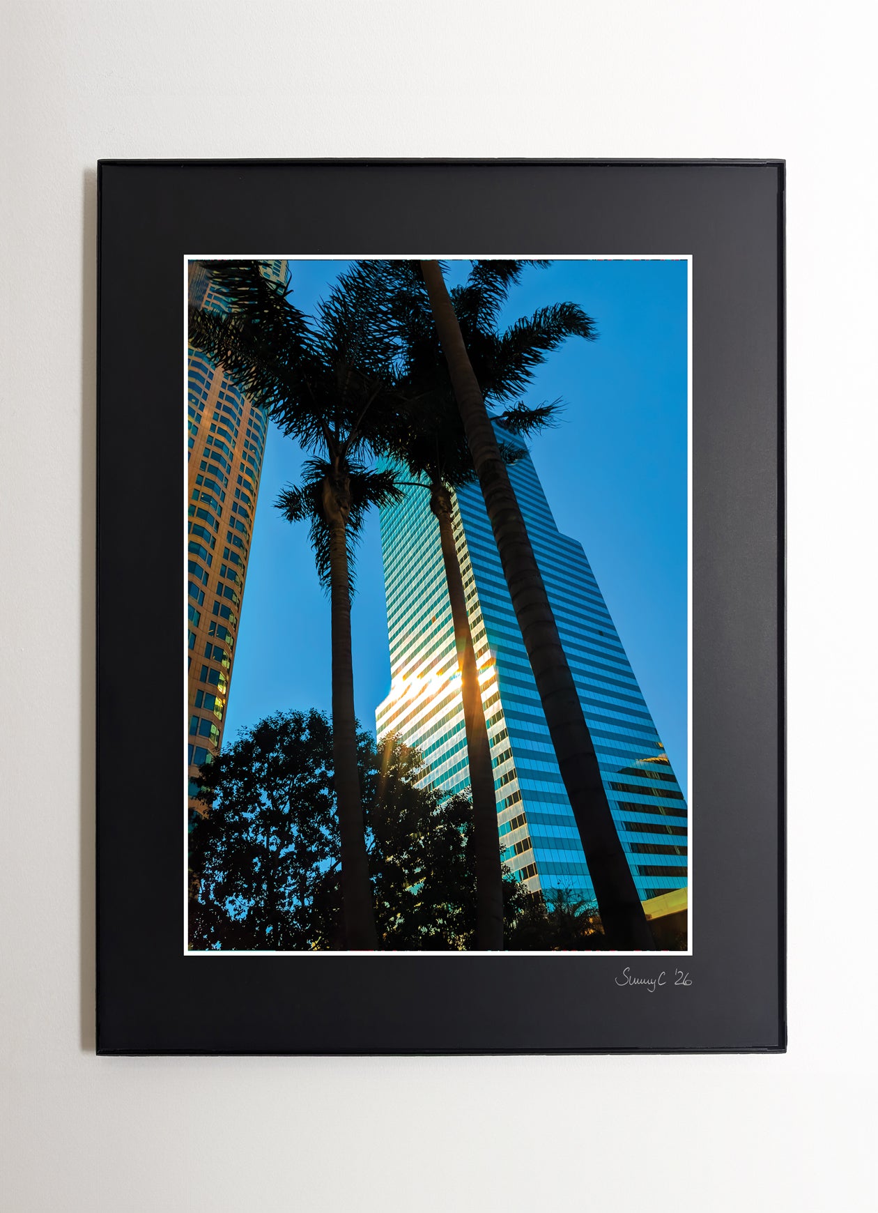 Framed photo print of the US Bank Tower in downtown Los Angeles at sunrise, with a golden glow and reflection of pastel skies