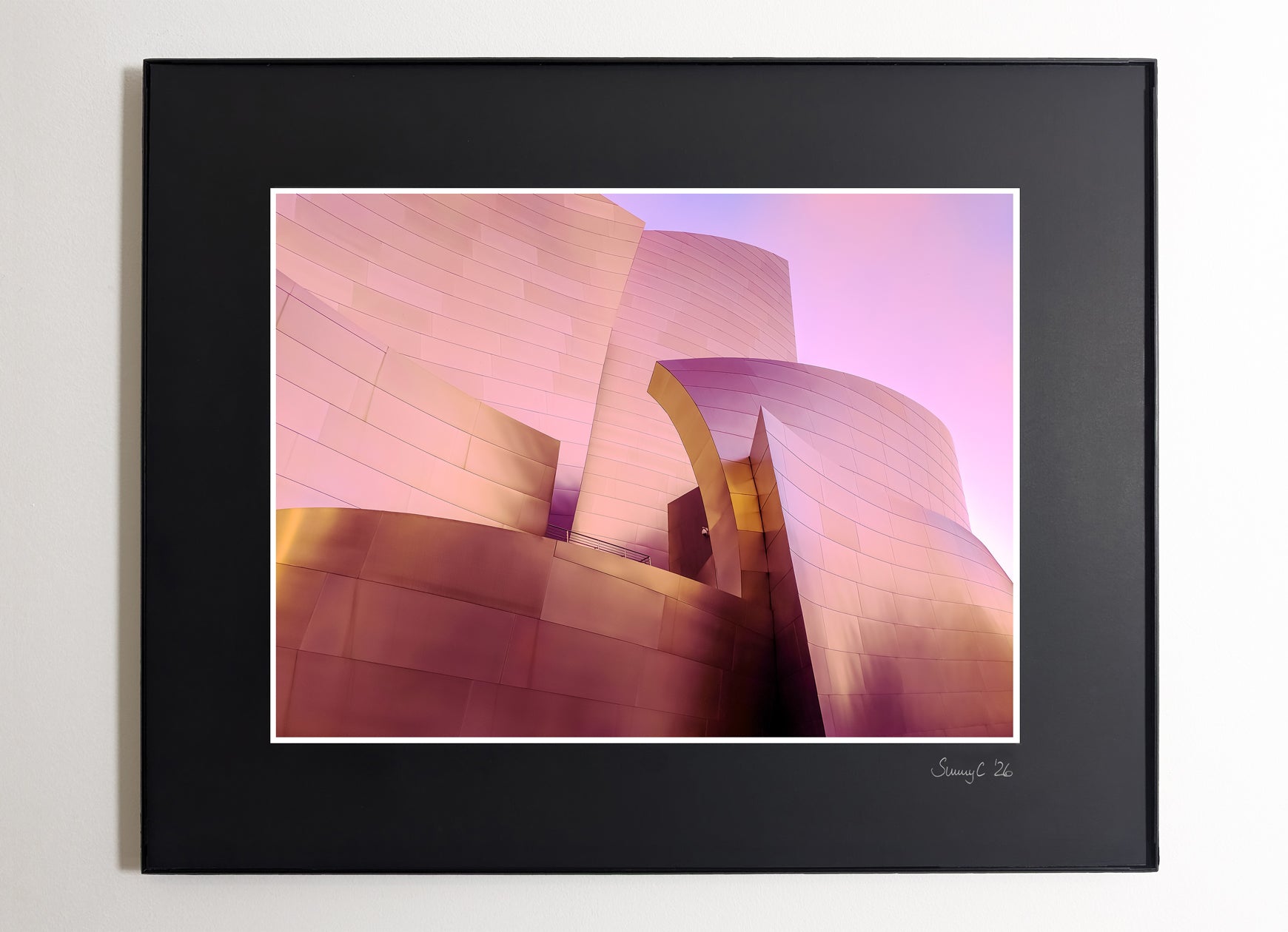 Framed fine art print of Frank Gehry’s Walt Disney Concert Hall in Los Angeles, featuring soft pink-toned metal and flowing architectural curves