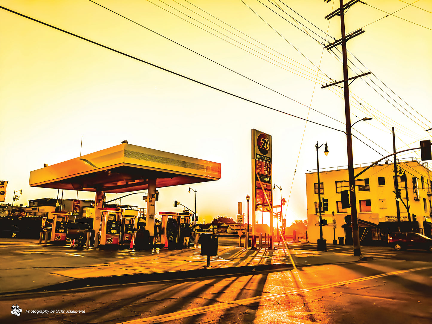 Fine art photo of a gas station in the morning sun on Broadway, highlighting vintage architecture in an urban cityscape
