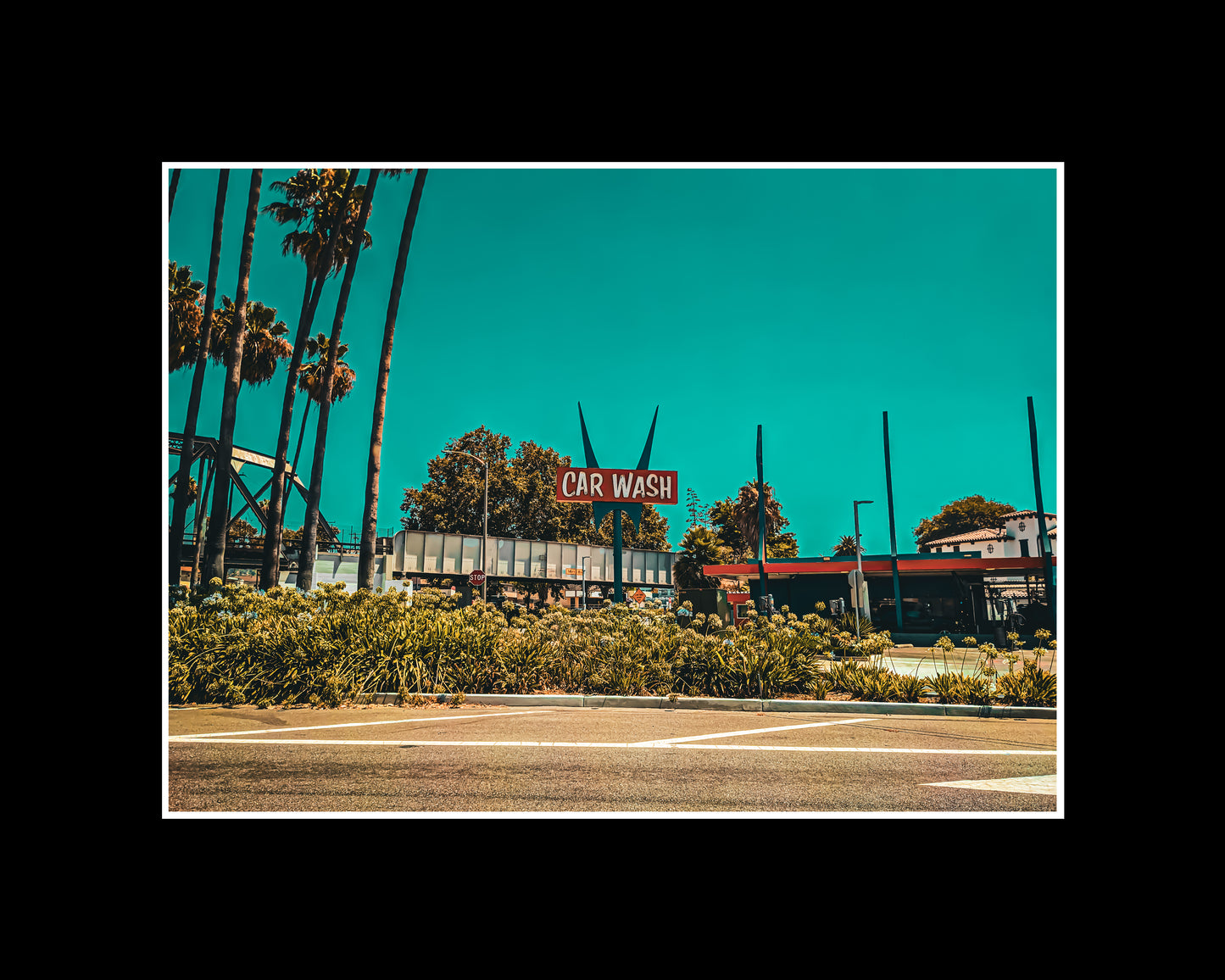 Photograph of a retro Googie-style car wash with bold signage and mid-century design