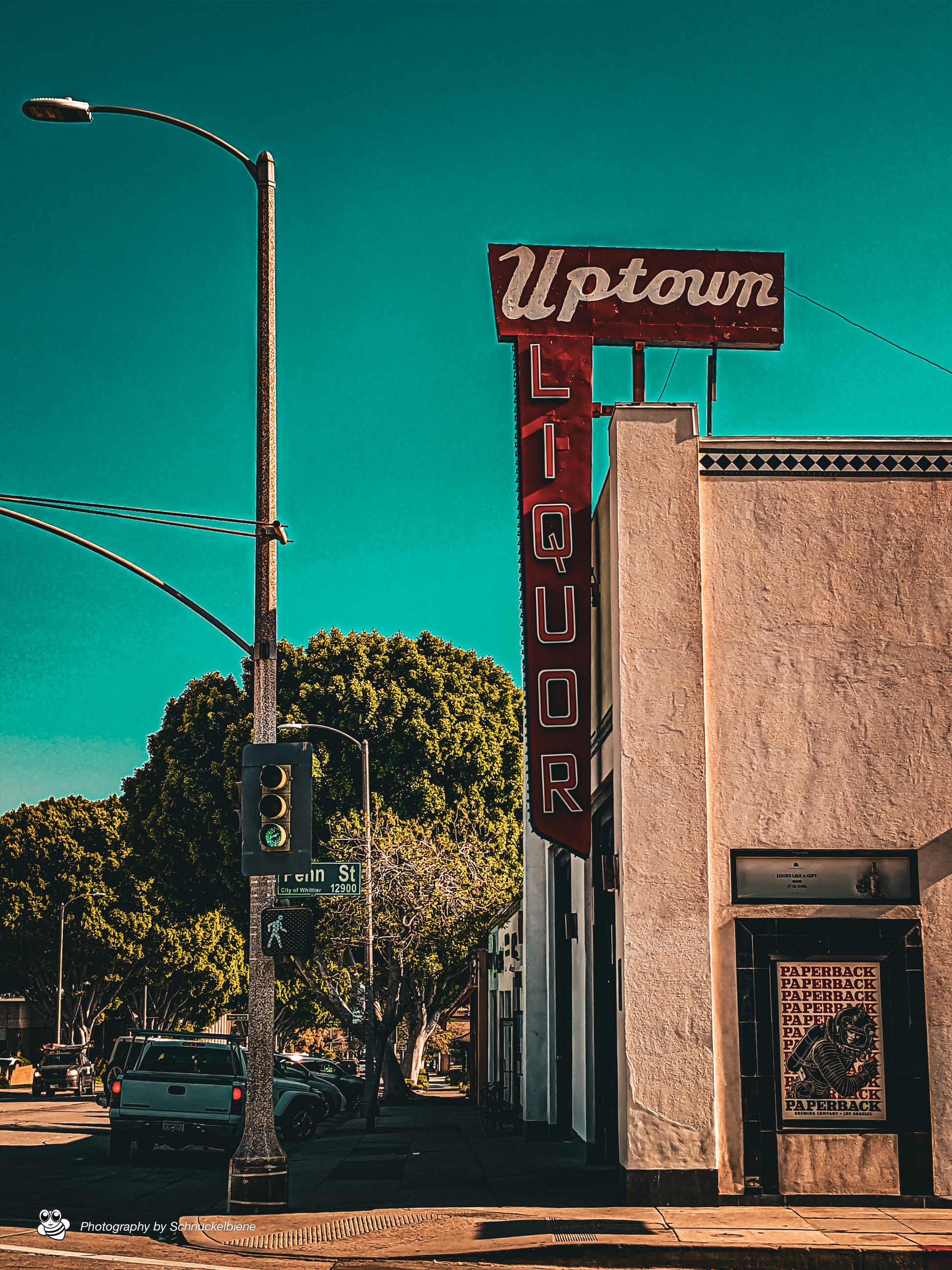 Framed photo print of the Uptown Whittier Liquor Shop vintage sign with retro typography and bold colors