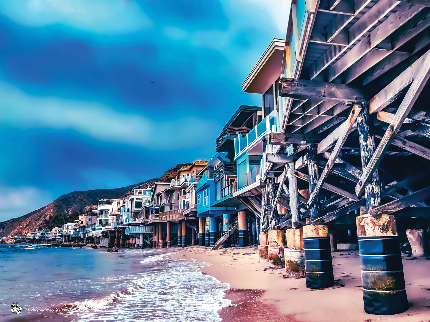 Photo of Malibu beachfront houses lined up along the California coast