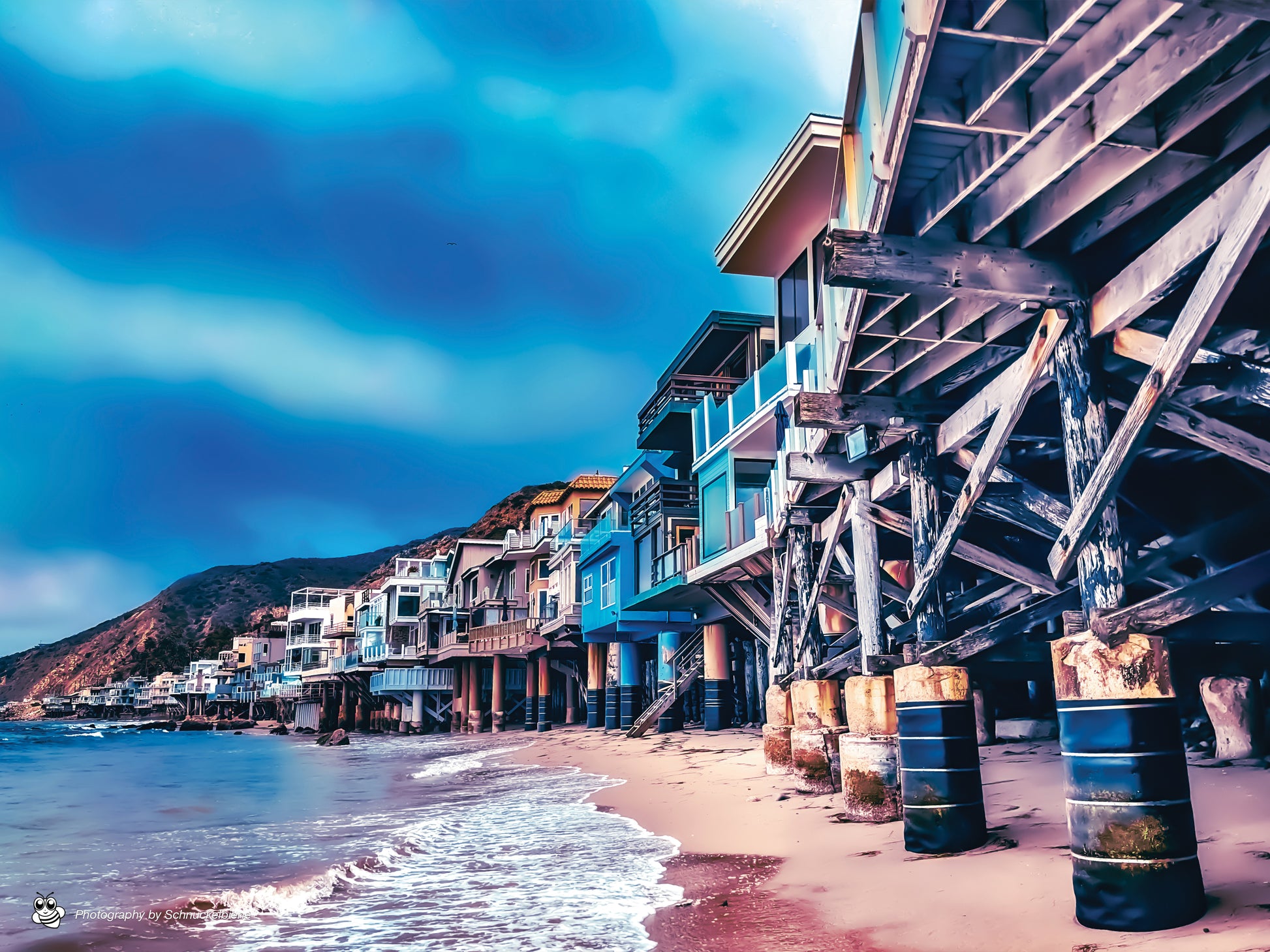 Photo of Malibu beachfront houses lined up along the California coast