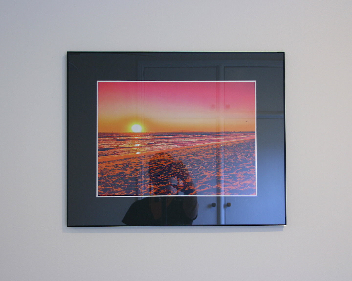 Pink sunset over Sunset Beach in Orange County, California with dreamy light