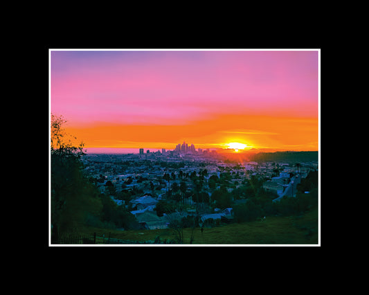 Sunset over Downtown Los Angeles skyline with glowing pastel sky
