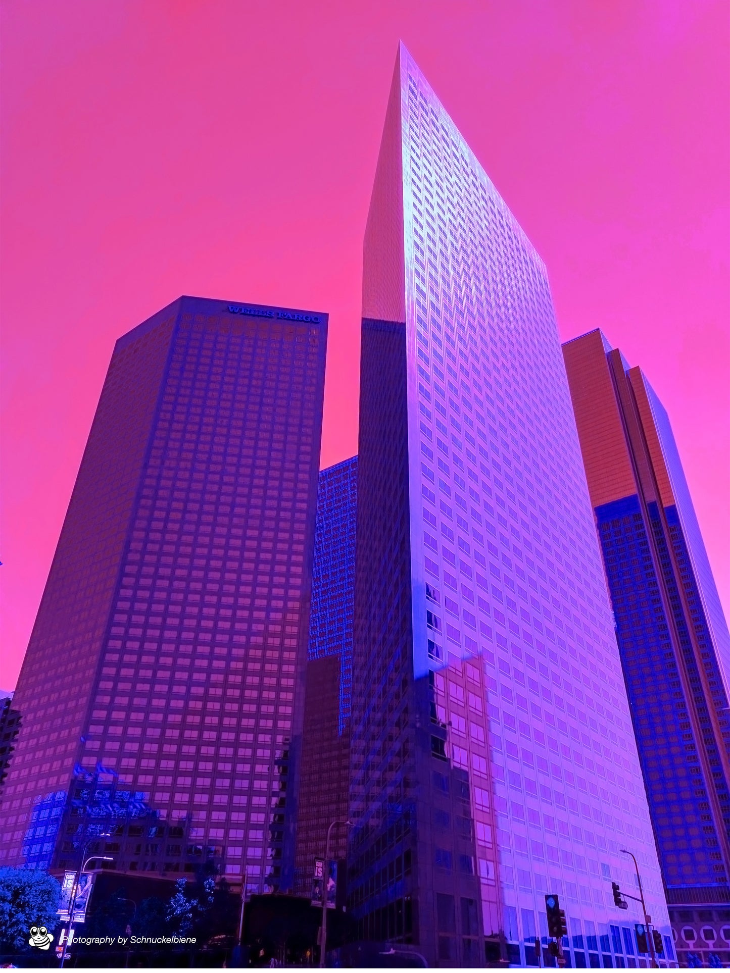 Framed fine art print of vibrant purple skyscrapers and a pink sky in downtown Los Angeles, showcasing a bold urban scene